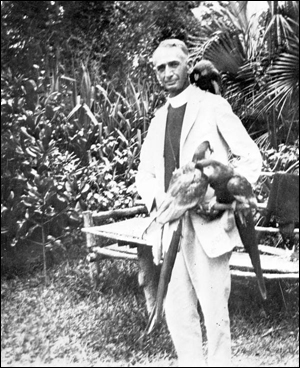 Pastor with pet macaws (1939)