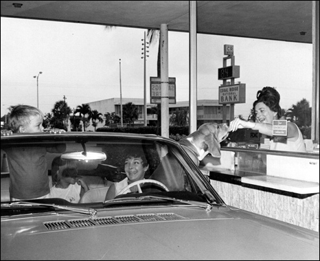 Dog receiving a treat at the Coral Ridge National Bank drive thru window: Fort Lauderdale, Florida (1969?)