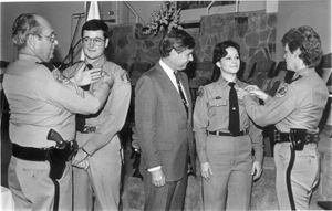 New recruits at Florida Highway Patrol are pinned by their parents: Tallahassee, Florida (1984)