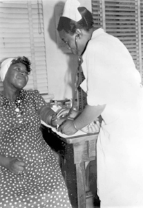Expectant mother having her blood pressure taken by a registered nurse in Leon County, Florida