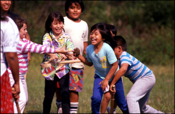 Seminole children playing stick-ball: Big Cypress Reservation, Florida (1989)