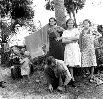 Migrant agricultural worker and his family: Canal Point, Florida (1939)