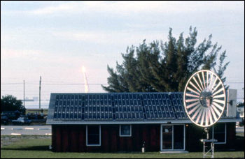 View of space shuttle launch behind renewable energy technologies of the Florida Solar Energy Center: Cape Canaveral, Florida (not before 1981)