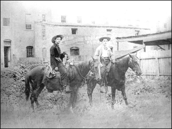 Two cowboys wearing handguns: Gainesville, Florida (189-)