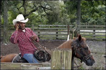 Tom Everett, Sr. with cell phone. Sumter County, September 2006.