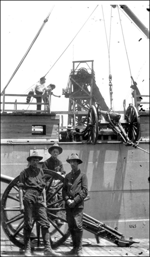 Cannons being loaded on transport preparing to sail to Cuba for the Spanish-American war: Tampa, Florida