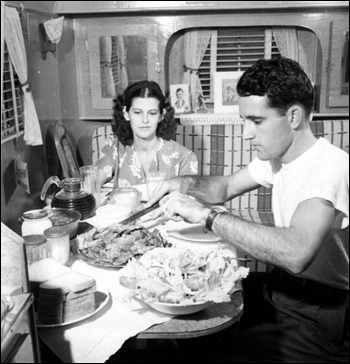 Al and Roey Stickles sit down to have a meal: Everglades National Park, Florida (1946)