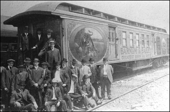 Men standing by Barnum & Bailey Circus railroad car (19__)