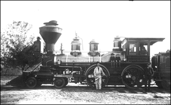 Boys and crew posed with Florida Railway and Navigation Company engine number 16 (ca. 1886)