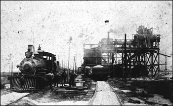 Loading phosphate onto railroad car (1911)