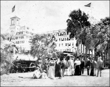 Royal Poinciana guests standing beside the hotel train (1896)