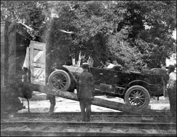 Car being loaded onto a train at De Leon Springs for a trip to Buffalo, New York (1912)