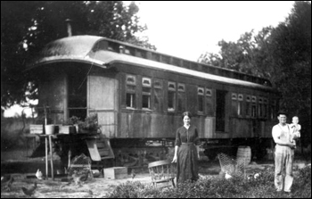 Family using a railroad car of the Tavares and Gulf Railroad as a home: Tavares, Florida (ca. 191_)