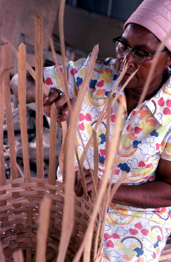 Lucreaty Clark weaving her white oak basket (not after 1979)