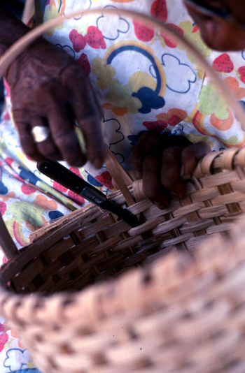 Close-up of Lucreaty Clark finishing her white oak basket (not after 1979)