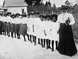 Mary McLeod Bethune with a line of girls from her school (ca. 1905)