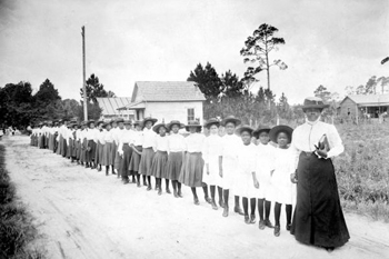 Mary McLeod Bethune with a line of girls from her school (ca. 1905)