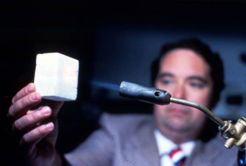 Man heating Space shuttle material during demonstration at the Kennedy Space Center