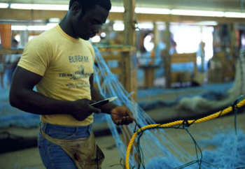 Trawl maker at work at Burbank Trawl Makers: Fernandina Beach, Florida (1982)