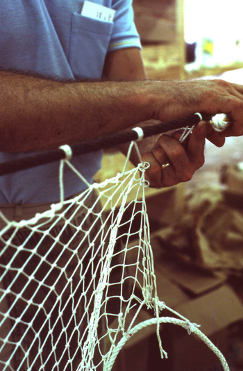 Possibly Billy Burbank III weaving a fishing net: Fernandina Beach, Florida (not after 1980)