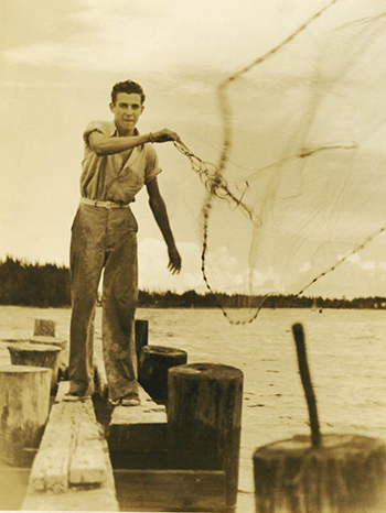 Man casting net for mullet: Riviera Beach, Florida (1939)