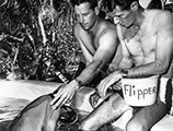 Filmmaker Ricou Browning and animal trainer Ric O'Feldman with Flipper the dolphin
