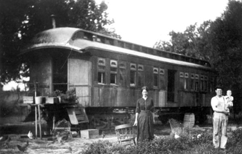 Family using a railroad car of the Tavares & Gulf Railroad as a home: Tavares, Florida (ca. 191-)