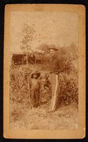 Soldier and boy posing with wooden gun