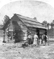 African American family and their log cabin