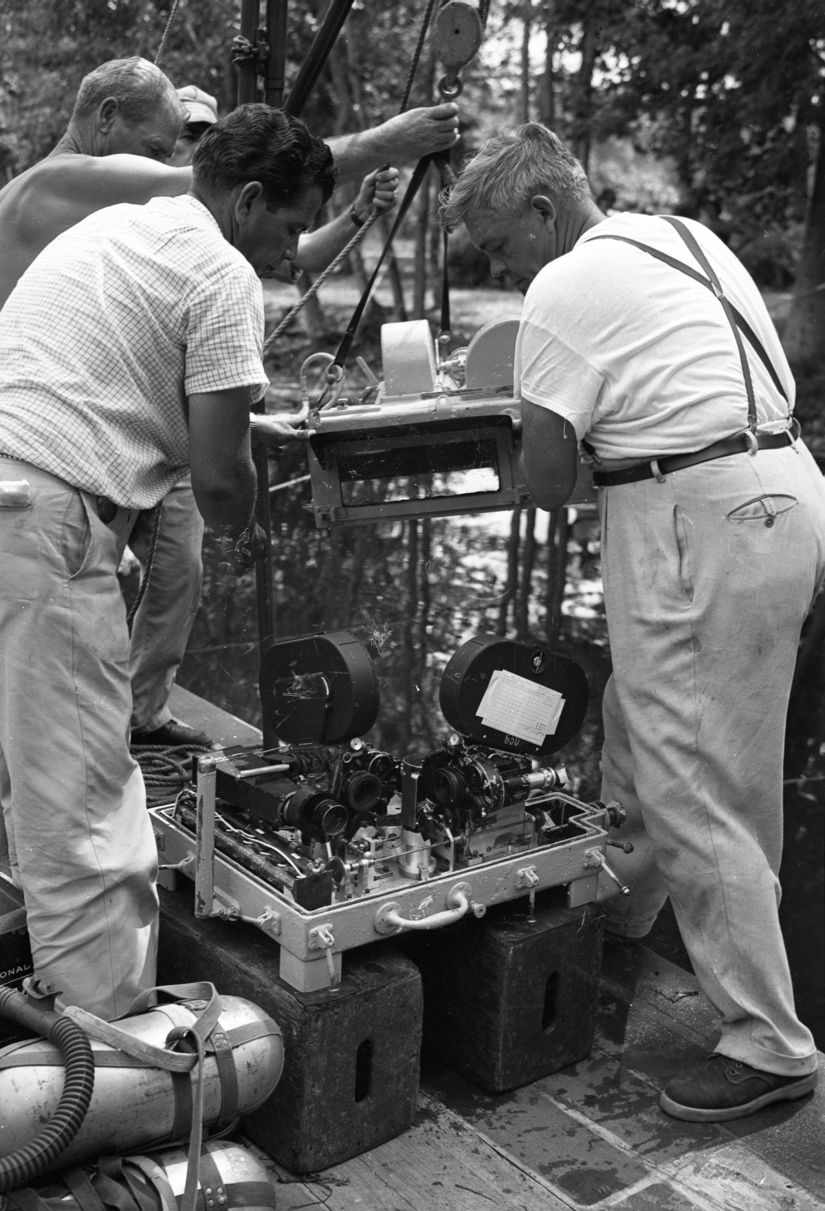 Film crew with underwater cameras and equipment on the set of Revenge of the Creature, 1954. Photo by Bruce Mozert.