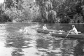 Crew and creature character in the water during filming of "Revenge of the Creature" movie.