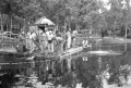 Crew working from floating platform during filming of the "Revenge of the Creature" movie at Silver Springs.