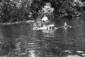 Crew with creature on film location for "Revenge of the Creature" movie at Silver Springs.