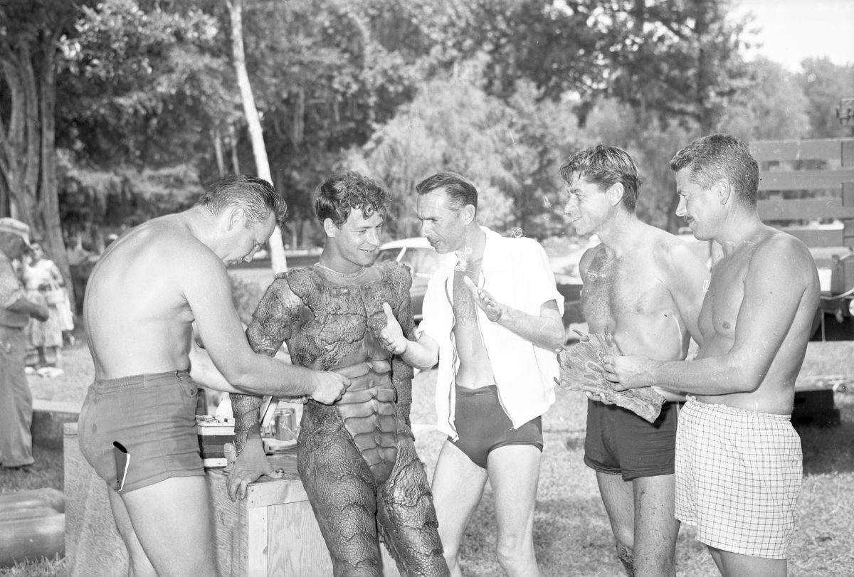 Director Jack Arnold (right), Ricou Browning as Gill Man and crew on the set of Revenge of the Creature at Silver Springs, 1954. Photo by Bruce Mozert.