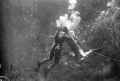 Ricou Browning breathing through air hose between takes of "Revenge of the Creature" movie at Silver Springs.