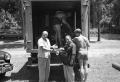 Universal International crew holding up film footage on the set of "Revenge of the Creature" movie.