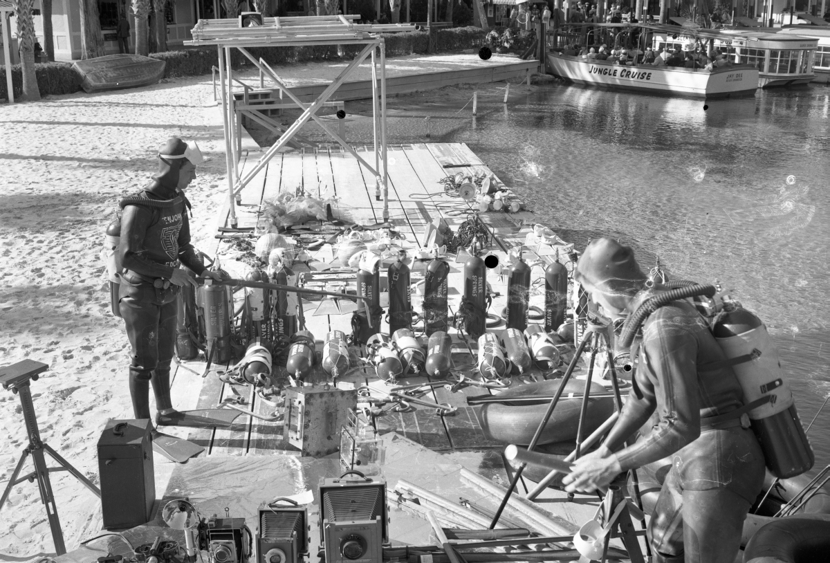 Scuba divers with underwater photography equipment and Silver Springs diving equipment.