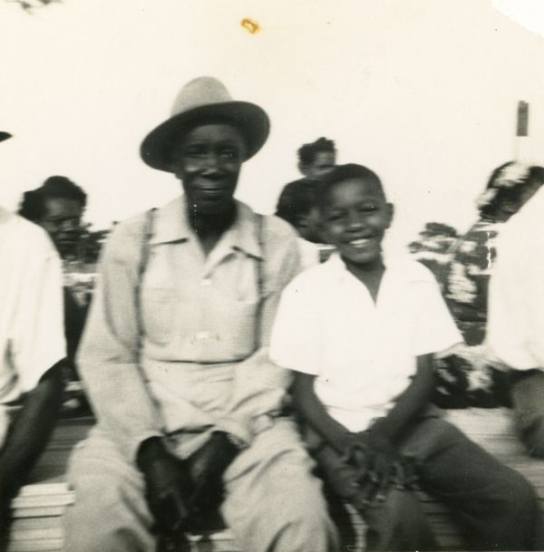 Tommy Scott, right, with man at ballfield during May Day celebration in Fort Walton Beach.