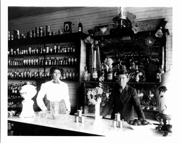 Margaret B. Barry and her son Bill at the family drug store, Suwannee Drug Company, in Newberry (photo circa 1908).