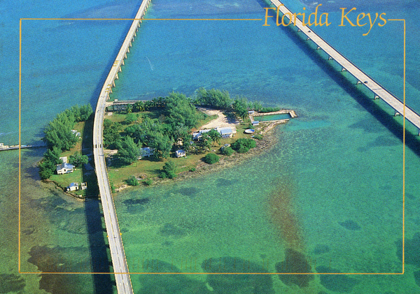 Postcard depicting Pigeon Key, with both the old and new Overseas Highway spans visible. The bridge at right is the currently used span, while the one at left connects Pigeon Key with the main highway (circa 1990s).