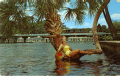 Betty Frazee posing on the lucky horseshoe palm tree at Silver Springs.