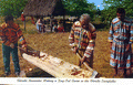 Florida Seminoles making a dug-out canoe in the Florida Everglades