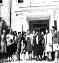 Mary McLeod Bethune with students in front of White Hall at Bethune-Cookman College.