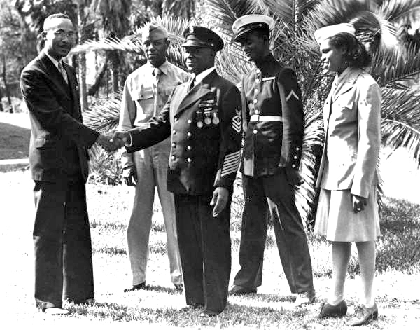 Administrator of Bethune-Cookman College with WWII vet and students.