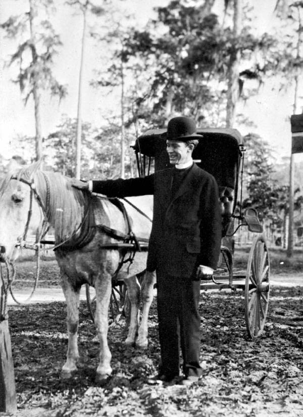 Rev. Dwight F. Cameron, Jr. with his horse and buggy. Cameron was a circuit riding minister in Volusia County in the early twentieth century (1916).