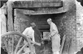 Loading a firebox at a turpentine distillery