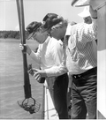 Jim Smith and Dempsey Barron look at their oysters - Apalachicola, Florida.