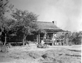 Close-up view showing "The Yearling" motion picture farmhouse