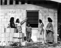 Charlotte Osceola points out features of her new home to friends - Dania, Florida
