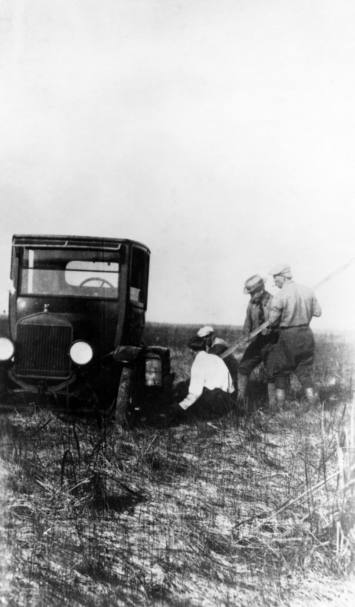 The Tamiami Trail, which now carries U.S. Highway 41 across the Florida Everglades, was once a muddy quagmire for much of its route.  The highway was completed in stages, and these men were the first to travel across the unfinished portion between Fort Myers and Everglades City.  The group included one commissary truck, seven Model T Fords, and a new Elcar.  Only the Model T Fords managed to complete the trip (1923).